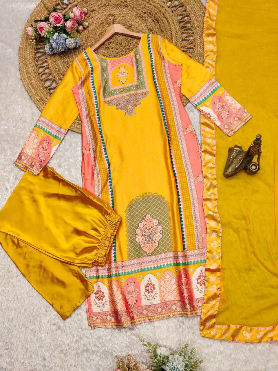 PURE SATIN SILK FEBRIC flaunt the amazing YELLOW color of this suit in your upcoming festivities. The divine and luxurious fabric with digital Print gives it elegant look. It is decorated suit set